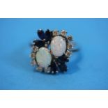 An 18ct white gold cluster ring set with opals, sa