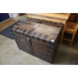 A large oak and metal strapped four handle silver chest