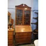 An Edwardian mahogany bureau bookcase