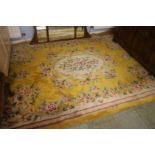 A yellow ground Chinese design rug