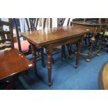 An Edwardian mahogany card table