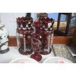 Pair of cranberry glass lustres etc.