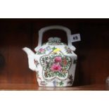 An Oriental tea pot