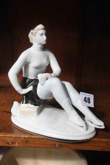 A Russian figure of an Ice Skater