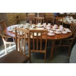 A teak table and five chairs