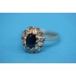 An 18ct white gold diamond and sapphire ring