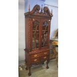 A reproduction mahogany display cabinet