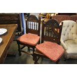 A pair of early jointed oak chairs