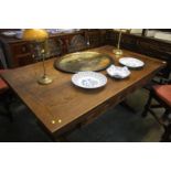 A good quality oak draw leaf refectory dining table