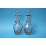 A pair of cut glass decanters