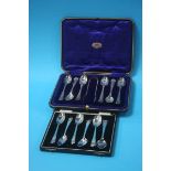 A cased set of six silver teaspoons and sugar tongs and another set of six silver teaspoons