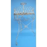 A Victorian circular wire jardiniere, with neo gothic galleries, on three swept legs