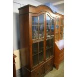 An Edwardian oak glazed cabinet