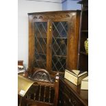 An oak Old Charm style corner cabinet