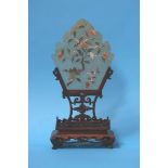A Chinese, jade table screen, on carved hardwood stand