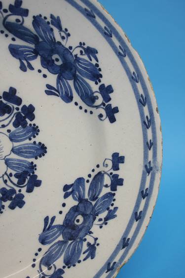 A late 18th century to early 19th century tin glazed earthenware blue and white plate. 35cm - Image 4 of 5