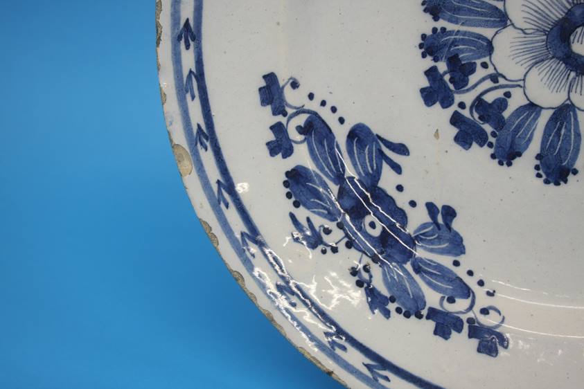 A late 18th century to early 19th century tin glazed earthenware blue and white plate. 35cm - Image 3 of 5