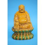 A large 19th century Sancai glazed figure of Buddha.