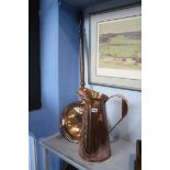 A copper warmer and a copper jug