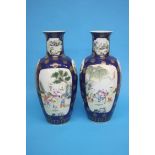 A large pair of famille rose vases, decorated with children, on powder blue ground, late 19th