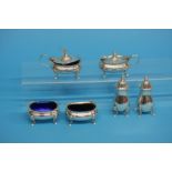 A silver mounted easel watch case holder and a silver six piece cruet set