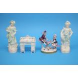 A Continental porcelain group of a girl and boy on a see-saw, a Continental porcelain dresser