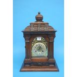 A walnut cased mantle clock with eight day movement, strike action. 47cm height