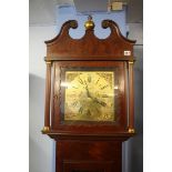 A reproduction mahogany long case clock