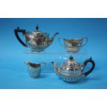 A silver Batchelors semi fluted, three piece tea set and a small silver semi fluted teapot. Total