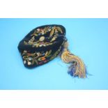 A Victorian, velvet smoking or thinking cap, with floral embroidered detail and original silk