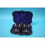 A cased set of six silver apostle spoons and a pair of sugar tongs, Sheffield 1902