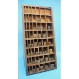 A Victorian, stained pine, freestanding letter press, printers block storage unit, containing 37