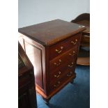 A reproduction mahogany chest of four drawers