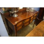 A good quality reproduction mahogany serpentine front, four drawer canteen of cutlery