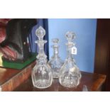 Three cut glass decanters