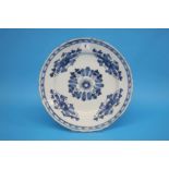 A late 18th century to early 19th century tin glazed earthenware blue and white plate. 35cm