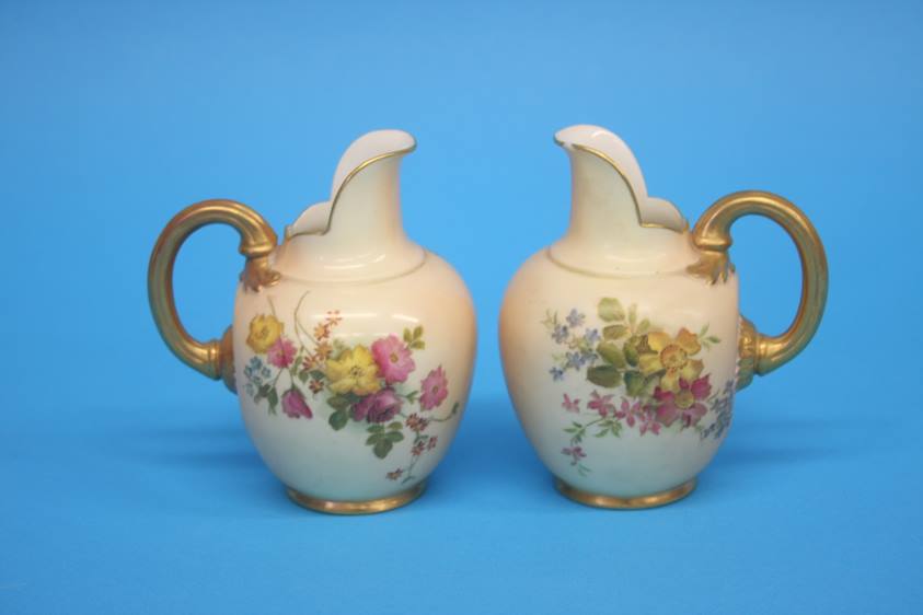 Two Royal Worcester flat back jugs, green printed marks, numbered 10/94. 11cm height