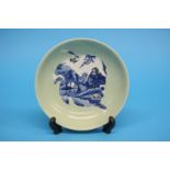 A blue and white celadon dish, Kangxi, with six character mark to base. 16.5 cm diameter