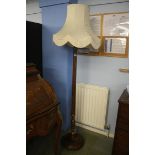 A walnut standard lamp and shade