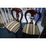 A pair of balloon back hall chairs