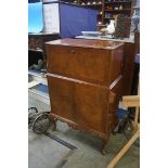 A walnut drinks cabinet