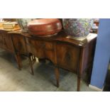 A good quality reproduction mahogany serpentine fronted sideboard, 152cm