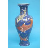 A large 19th century famille rose vase, decorated with goldfish, on a powder blue ground. 46 cm