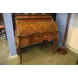 A walnut Louis XV style cylinder bureau