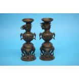 A pair of Chinese bronze 19th century pricket sticks, marks to base.