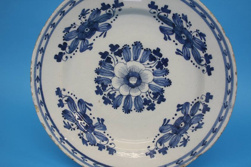 A late 18th century to early 19th century tin glazed earthenware blue and white plate. 35cm - Image 2 of 5