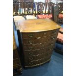 A reproduction walnut, bow front chest of six drawers