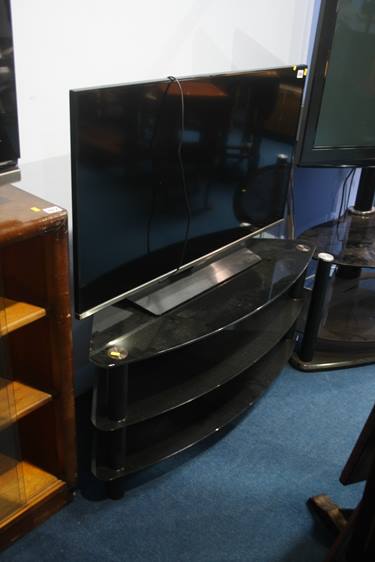 A Samsung TV and stand