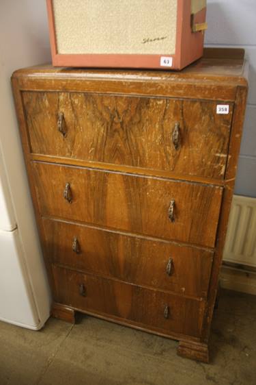 A walnut chest of drawers