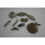 Various silver and other brooches
